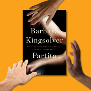 Hands reaching for new Barbara Kingsolver book