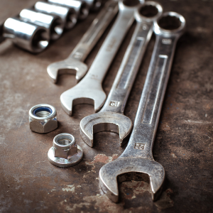 Assorted metal tools including 4 spanners and two bolts