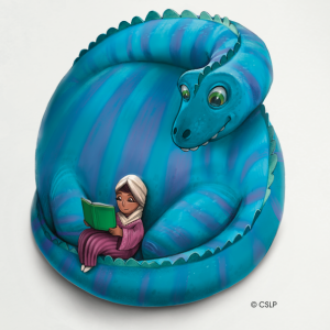 child reading in lap of curled up dinosaur with long neck and tail